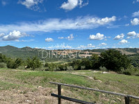 Large semi-detached farmhouse with land and olive trees in a panoramic position